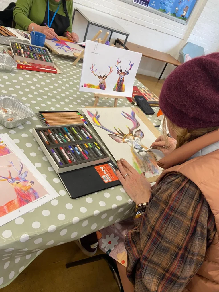 Guildford art class student working on their pastel artwork