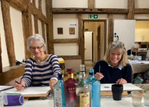 Horsham duo having fun painting at our art class.