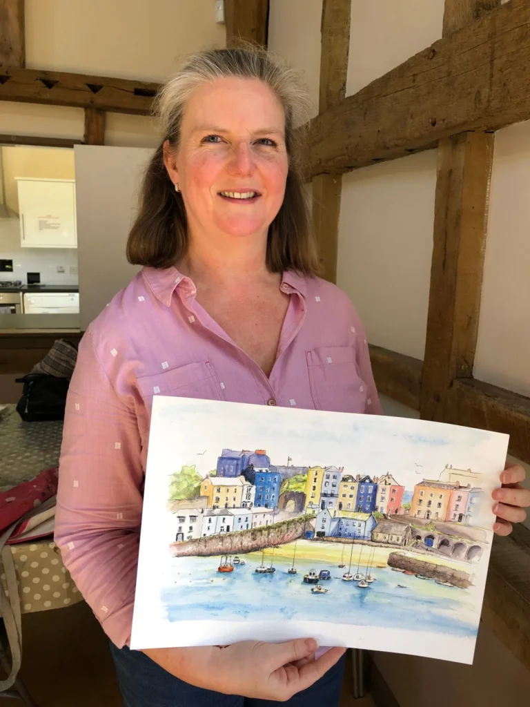Horsham art class student proudly showing her beautiful seaside painting.