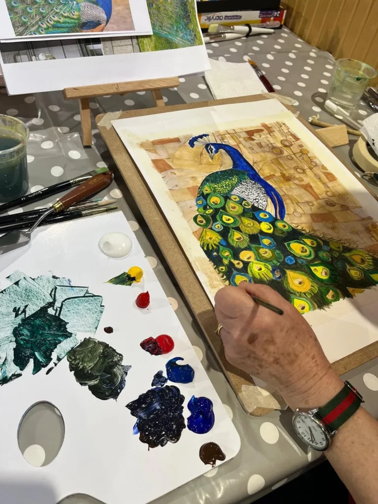 Beautiful watercolour peacock painting created by a student during one of our art classes